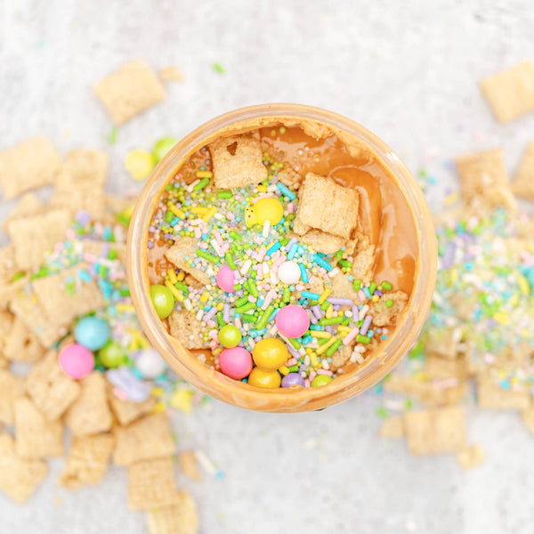 Bunny Bait Peanut Butter topped with Vanilla Chex Cereal, White Chocolate Chips and Sprinkles, American Dream Nut Butter